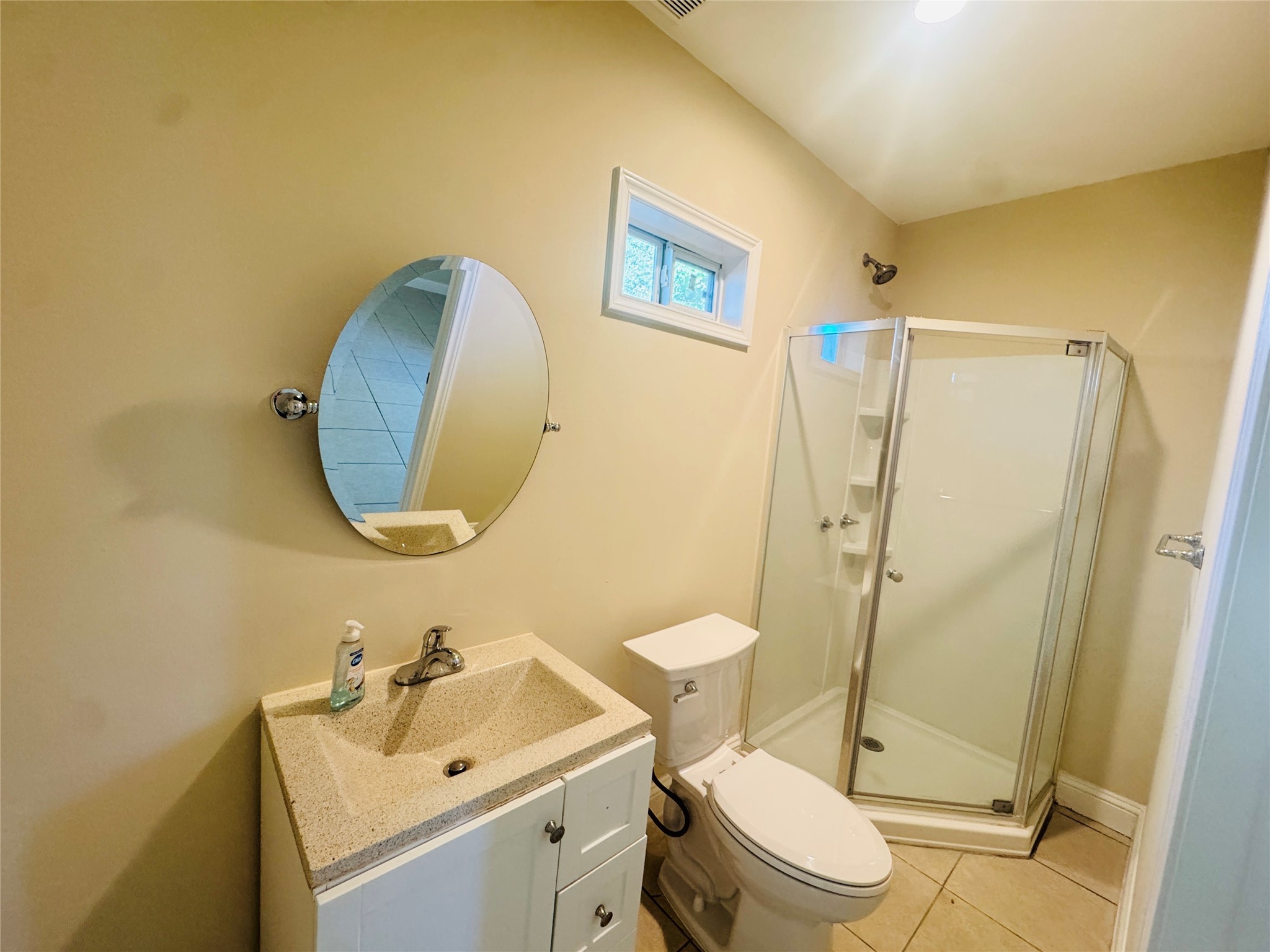 605 Tovrea Road Alvin, TX 77511 - Photo 16 of 18 a bathroom with a sink mirror toilet and shower