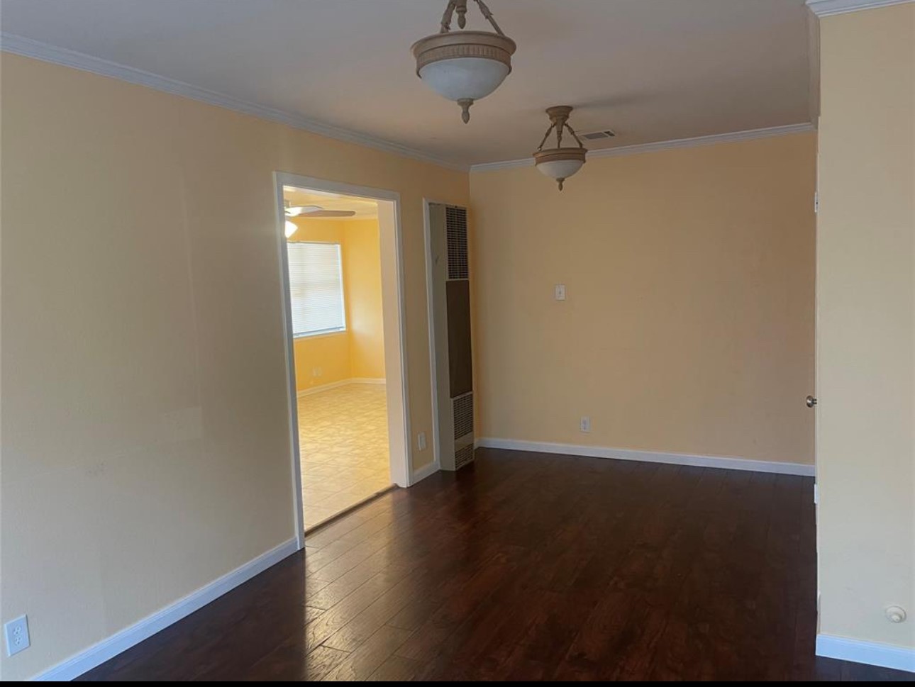 605 Tovrea Road Alvin, TX 77511 - Photo 3 of 18 a view of an empty room with wooden floor and a window