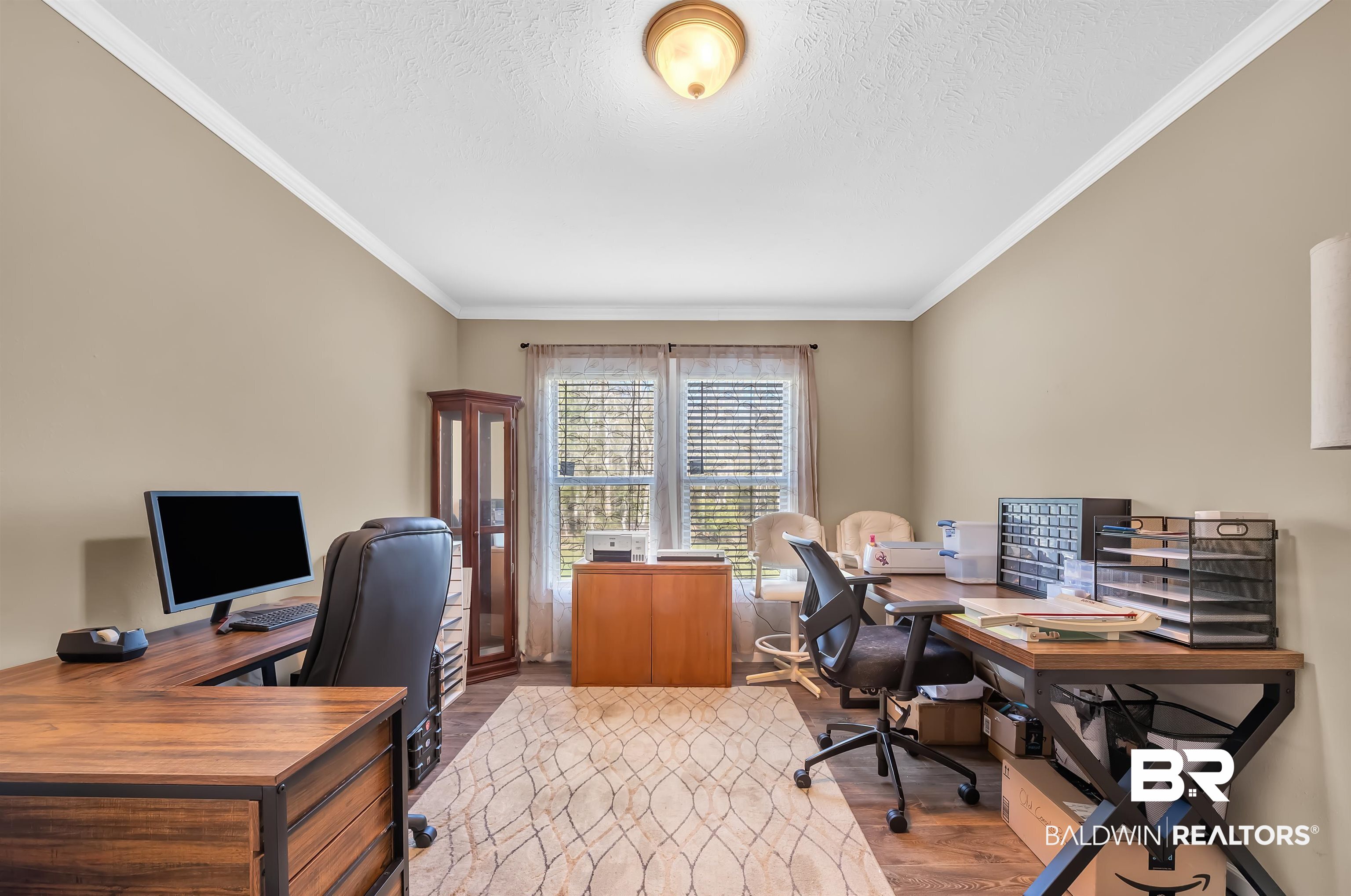 23233 Forland Road Silverhill, AL 36576 - Photo 25 of 33 Home office featuring crown molding, a textured ceiling, and wood finished floors