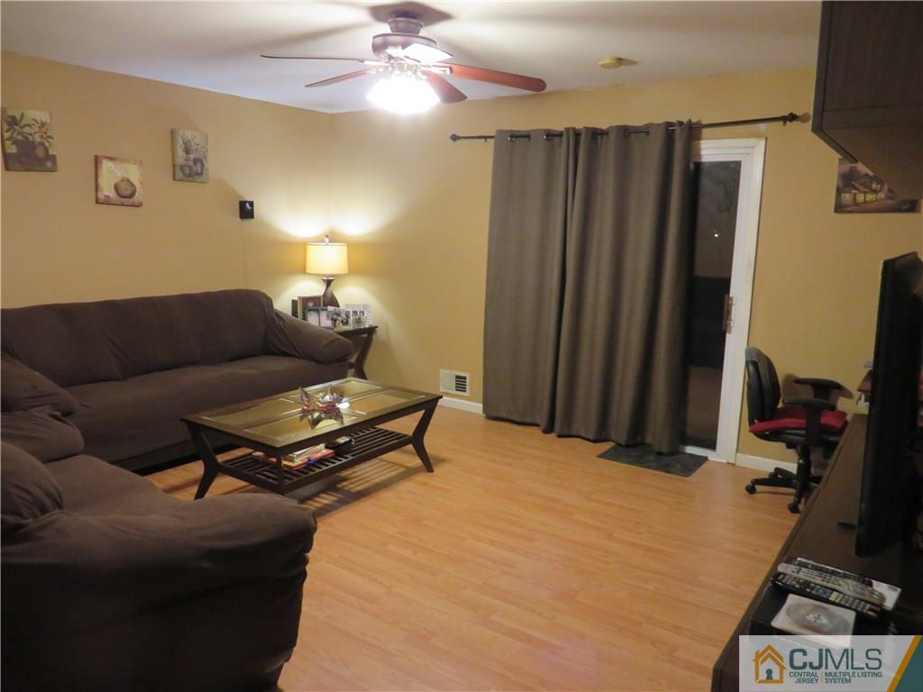 88 Princeton Road Old Bridge, NJ 08859 - Photo 5 of 10 a living room with furniture and a flat screen tv