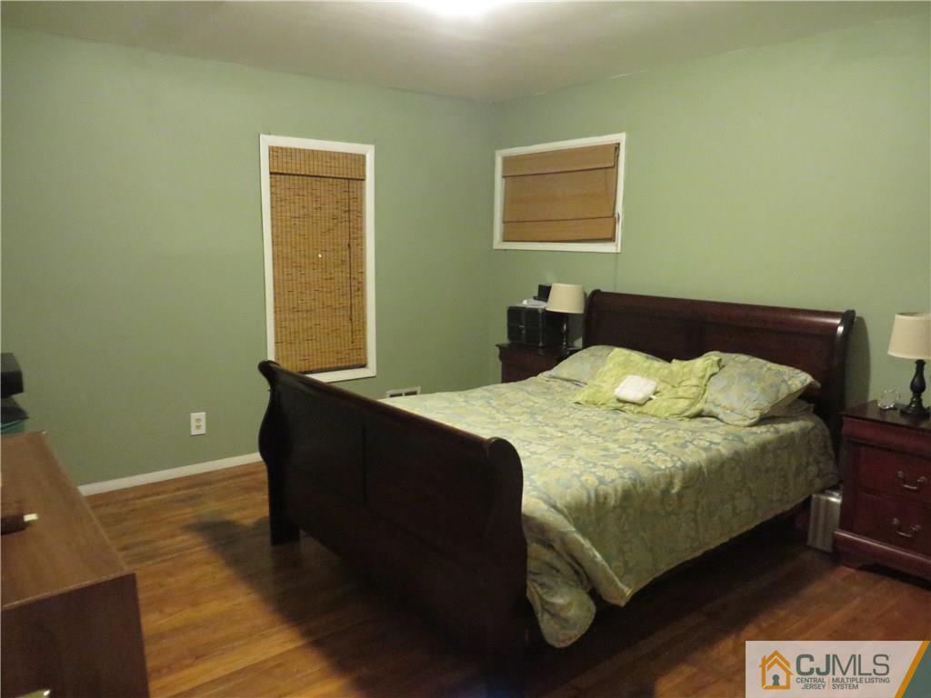 88 Princeton Road Old Bridge, NJ 08859 - Photo 7 of 10 a bed sitting in a bedroom next to a window