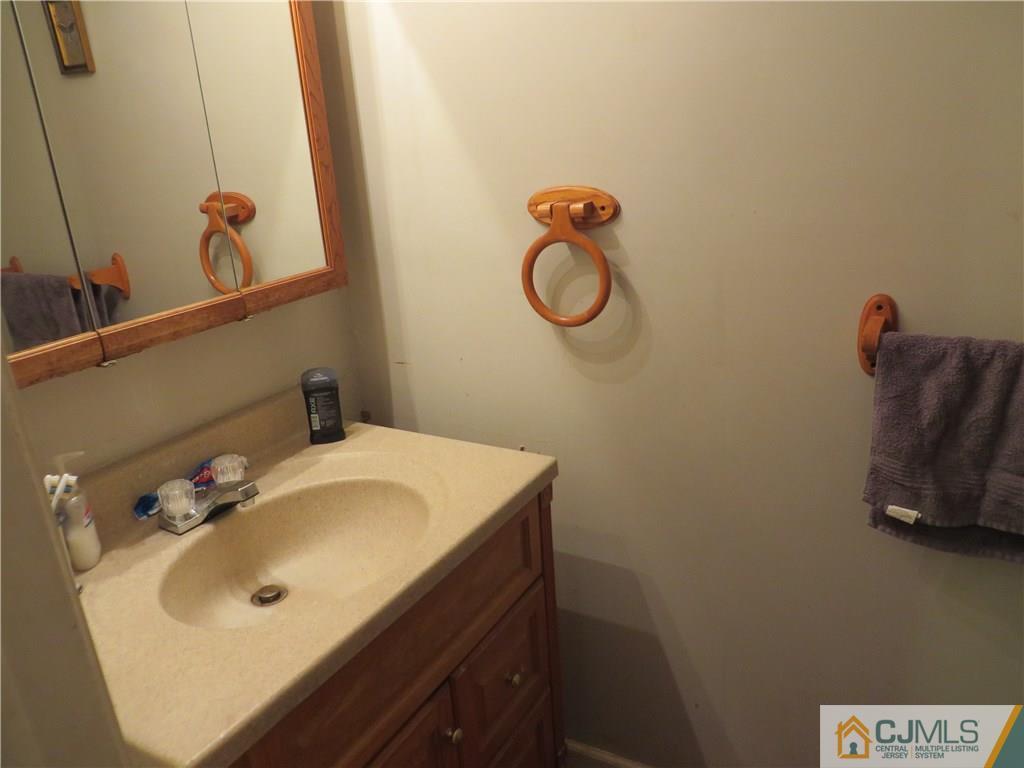 88 Princeton Road Old Bridge, NJ 08859 - Photo 10 of 10 a bathroom with a sink and a mirror