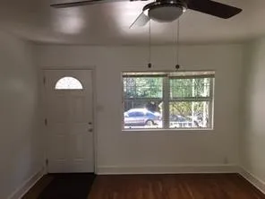 a view of an empty room with a window