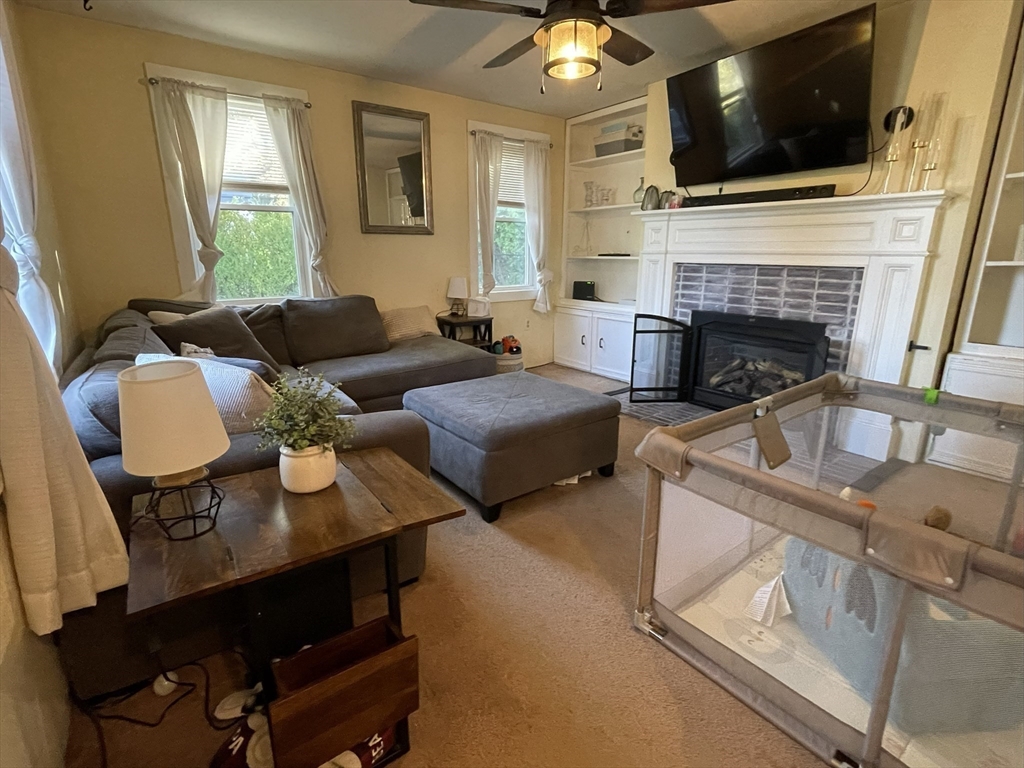 9 Watt Road Worcester, MA 01606 - Photo 15 of 36 a living room with furniture and a flat screen tv