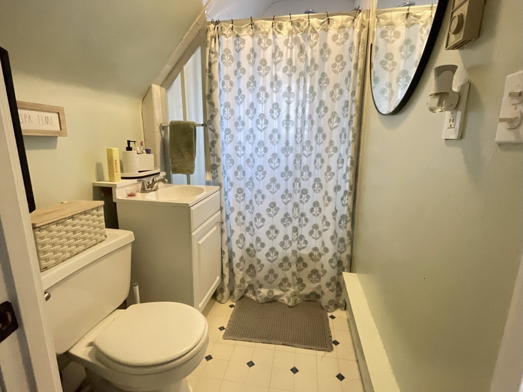 9 Watt Road Worcester, MA 01606 - Photo 25 of 36 a white toilet sitting next to a bathroom sink and a shower