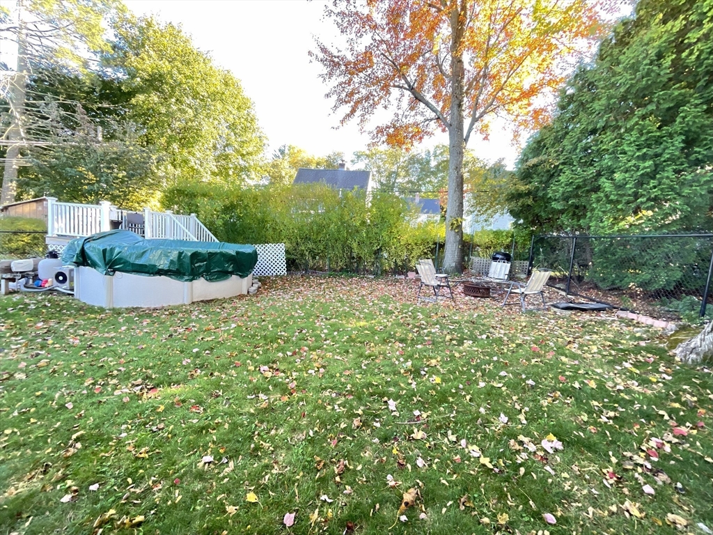 9 Watt Road Worcester, MA 01606 - Photo 32 of 36 a backyard of a house with table and chairs