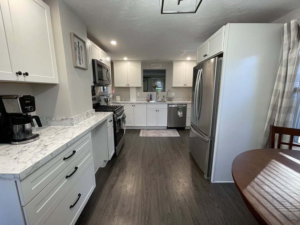 9 Watt Road Worcester, MA 01606 - Photo 5 of 36 a large kitchen with stainless steel appliances sink refrigerator and microwave