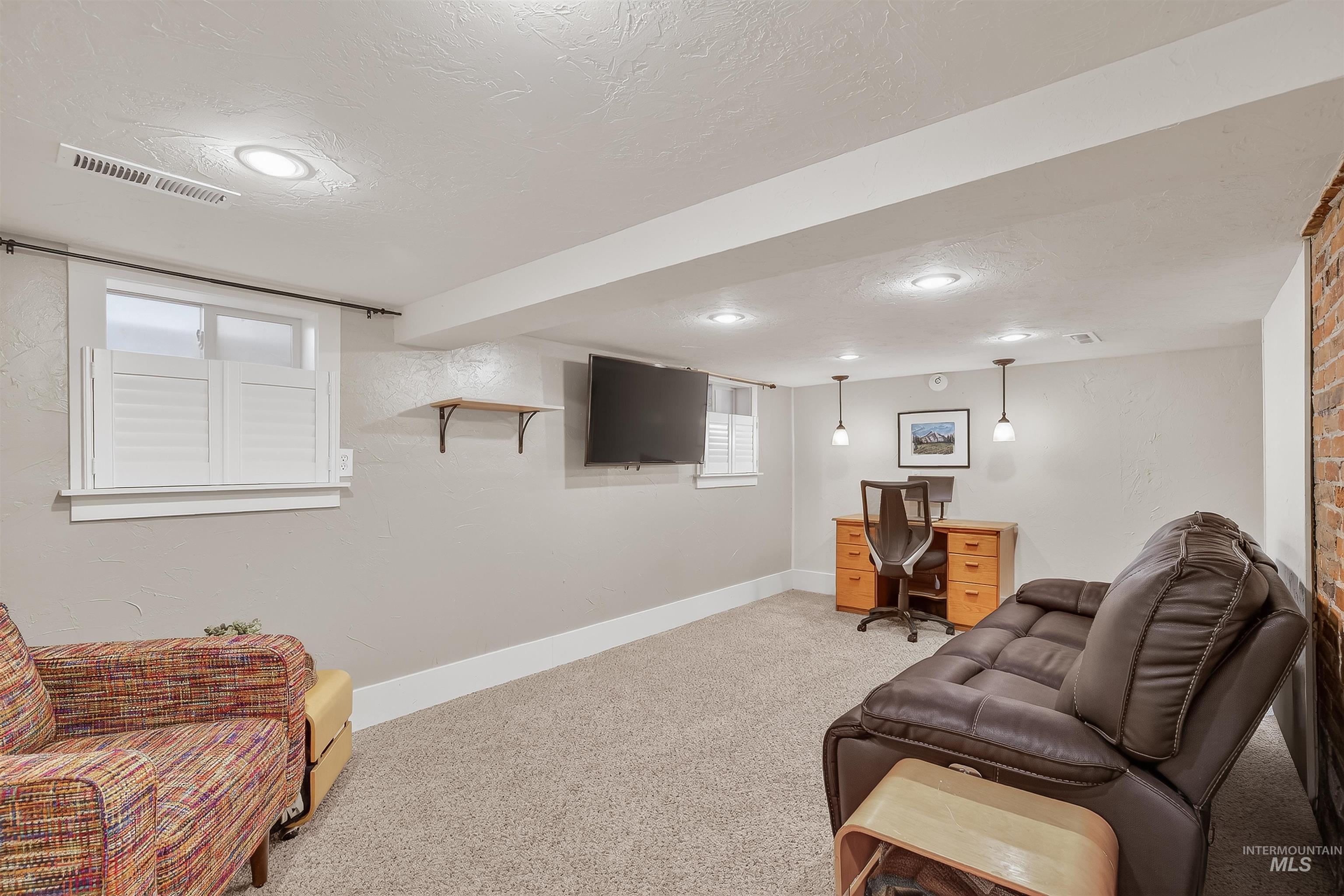 1209 3rd Street Lewiston, ID 83501 - Photo 33 of 49 Living area featuring light carpet, recessed lighting, a textured ceiling, and a desk