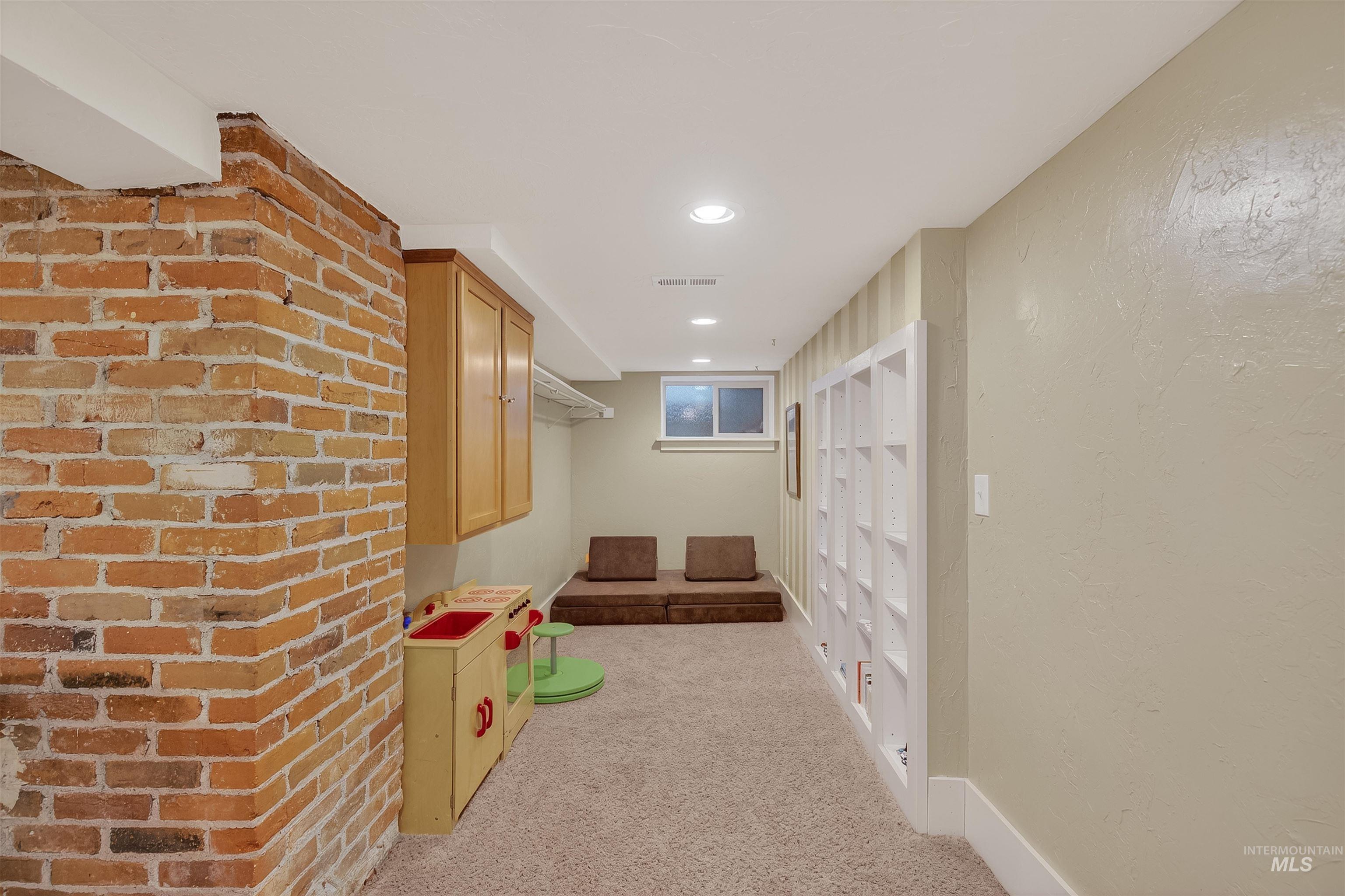 1209 3rd Street Lewiston, ID 83501 - Photo 34 of 49 Rec room featuring light colored carpet, a textured wall, and recessed lighting