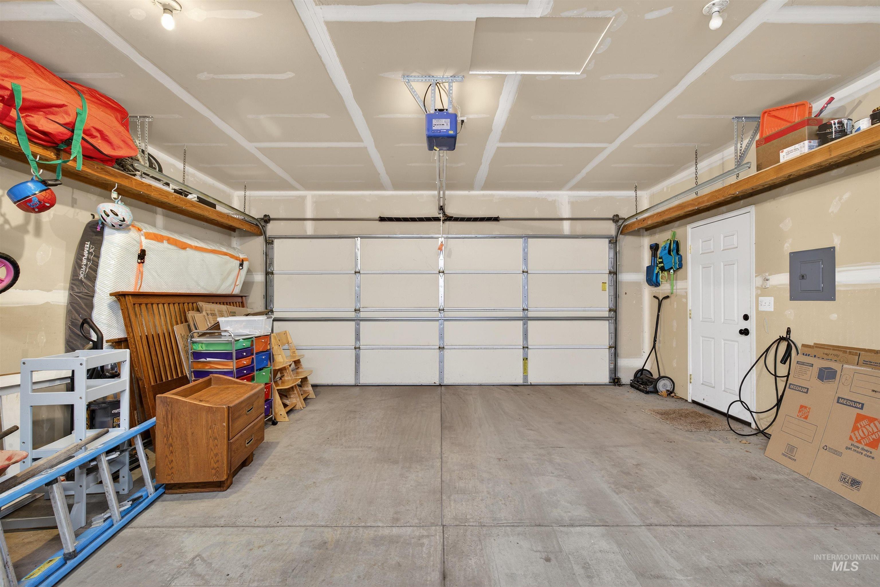 1209 3rd Street Lewiston, ID 83501 - Photo 44 of 49 Garage featuring electric panel and a garage door opener
