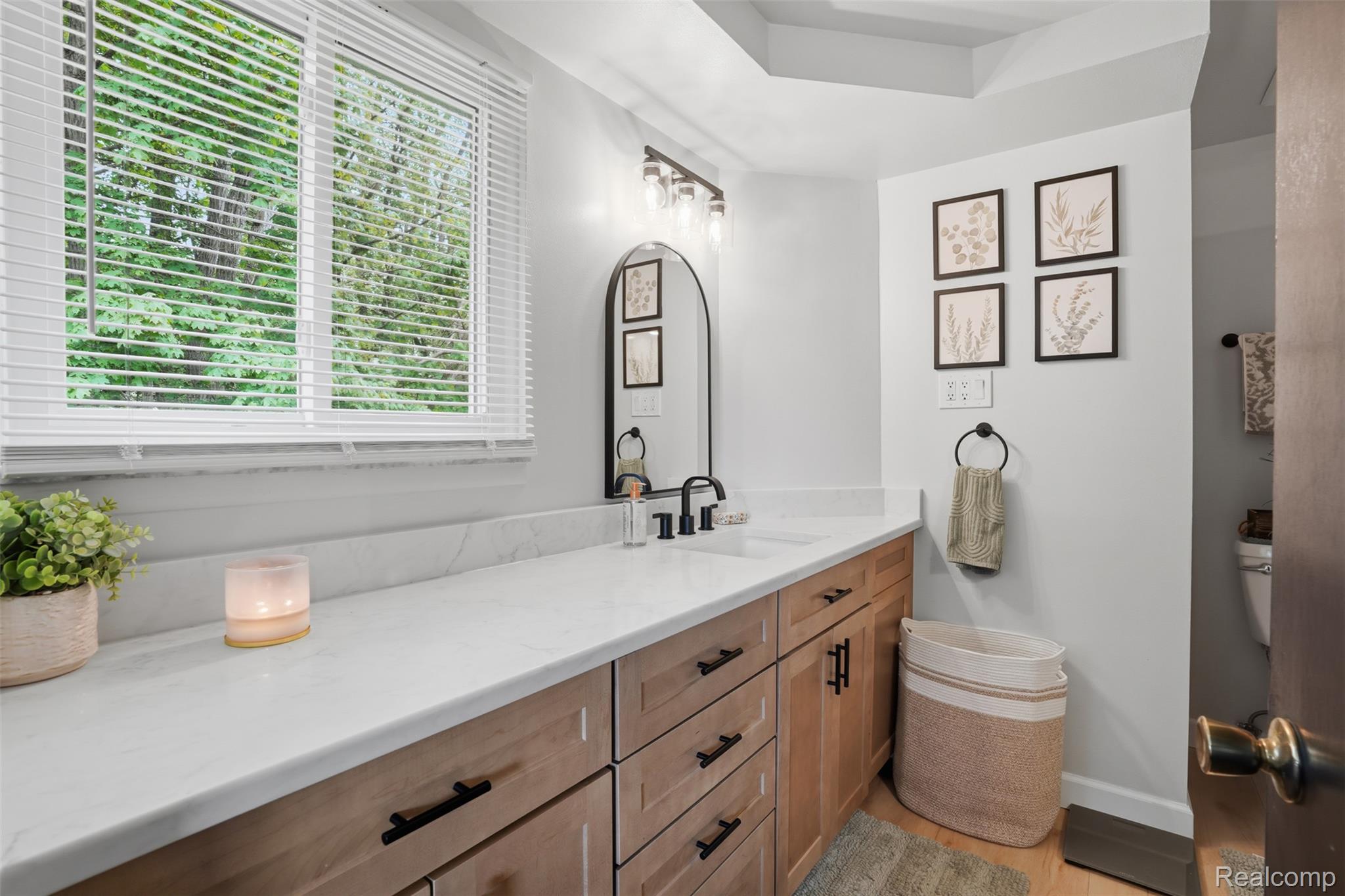 47129 Dunsany Road Northville, MI 48167 - Photo 22 of 49 Bathroom featuring vanity and light wood-style flooring