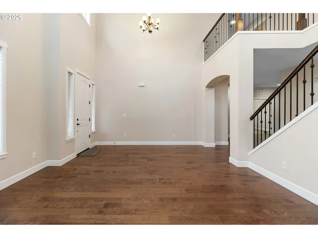 a view of an empty room with stairs