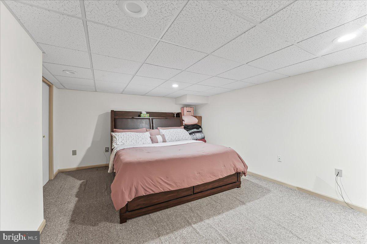 320 Lees Bridge Road Nottingham, PA 19362 - Photo 31 of 45 a bedroom with a bed and wooden floor