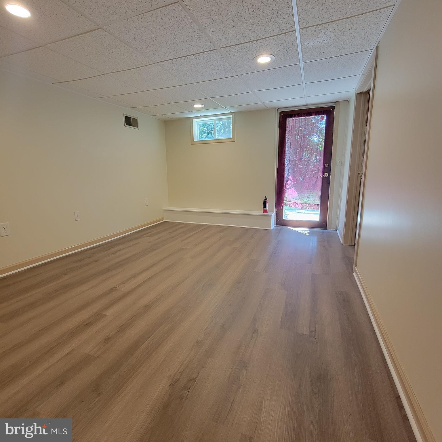 320 Lees Bridge Road Nottingham, PA 19362 - Photo 44 of 45 an empty room with wooden floor and windows