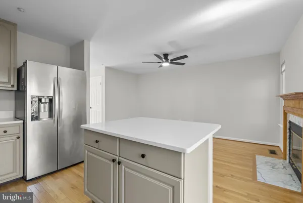 a kitchen with a refrigerator and countertop