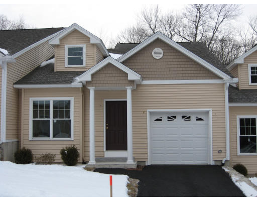 3 Winterberry Road, Unit 8 Pelham, NH 03076 - Photo 1 of 1 a front view of a house with a yard