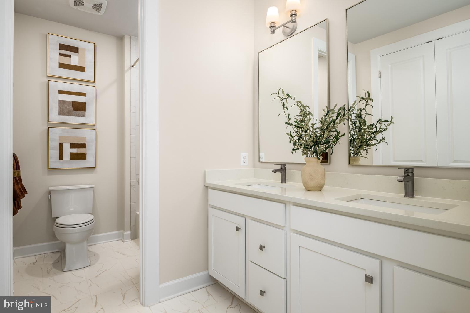 3183 Leopold Court Huntingdon Valley, PA 19006 - Photo 20 of 33 a bathroom with a toilet sink and mirror