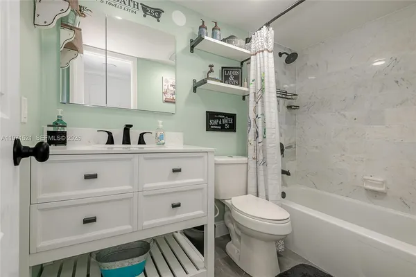 a view of a hallway with washer and dryer