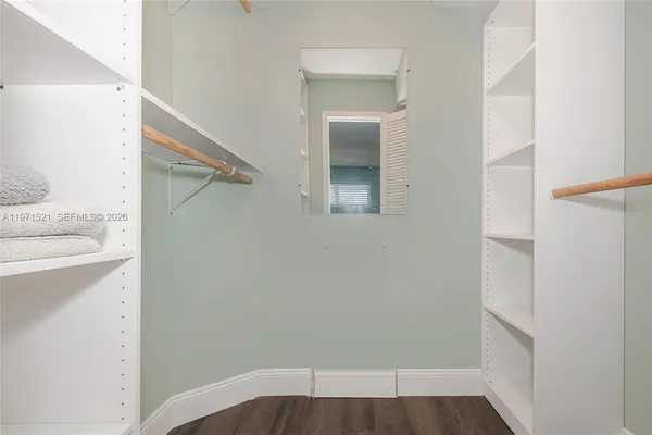 a bathroom with a shower a toilet and sink