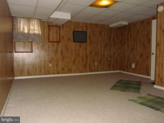 444 Stemmers Run Road Essex, MD 21221 - Photo 23 of 30 a view of an empty room with a window