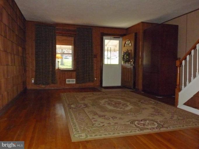 444 Stemmers Run Road Essex, MD 21221 - Photo 4 of 30 an empty room with windows