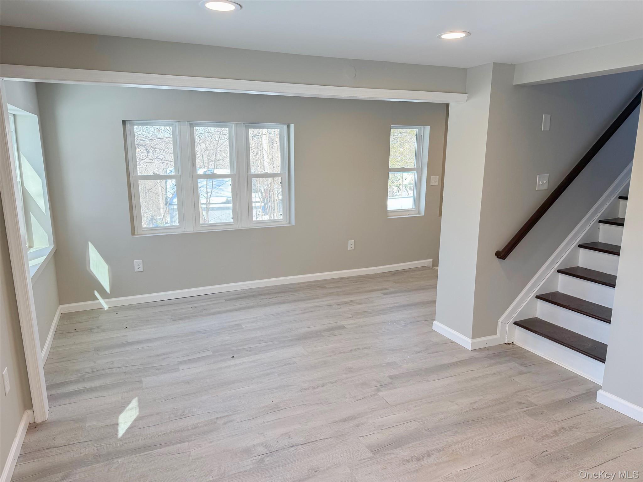 9 Underhill Trail Monroe, NY 10950 - Photo 13 of 18 a view of an empty room with wooden floor and a window
