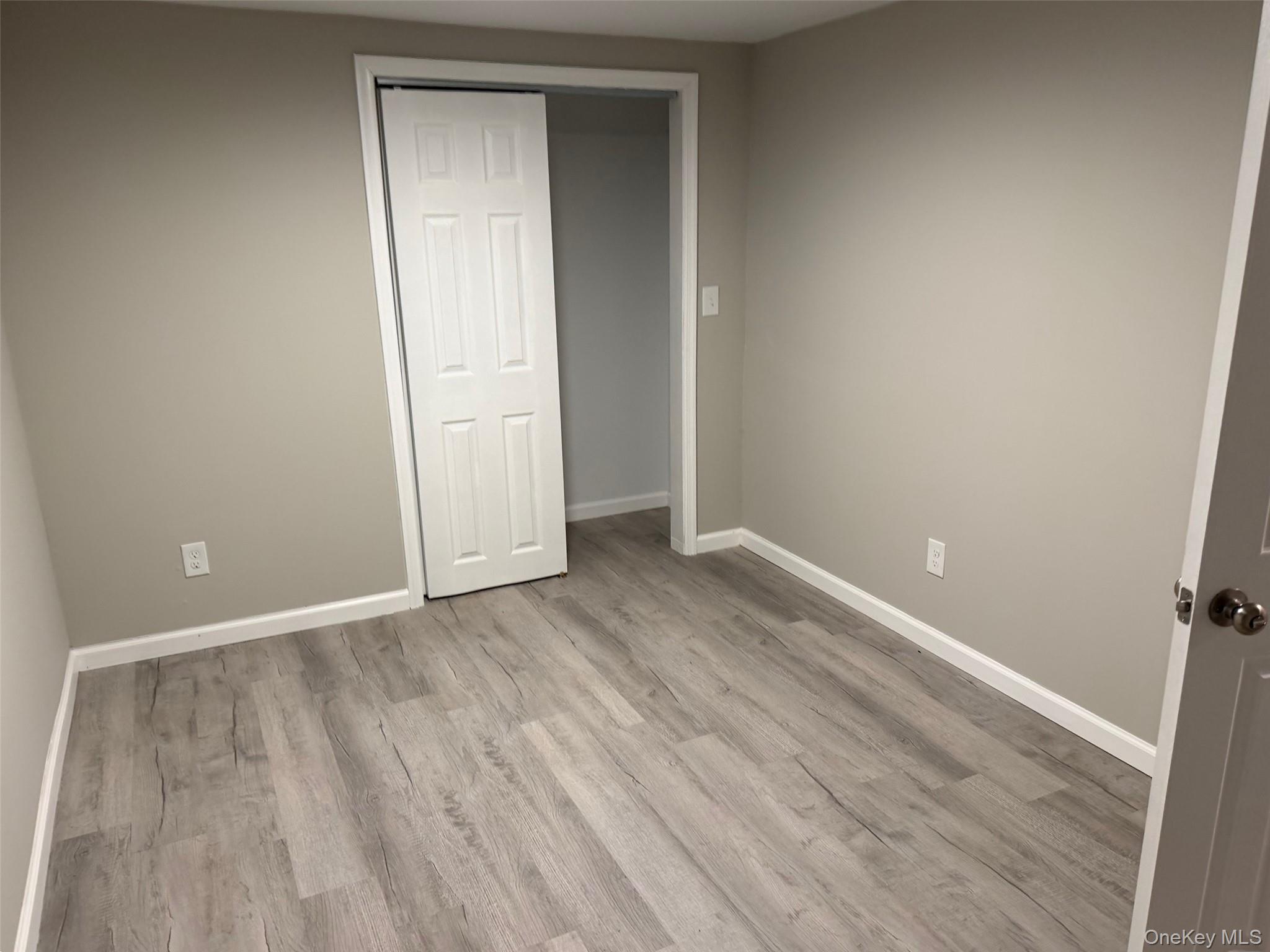 9 Underhill Trail Monroe, NY 10950 - Photo 16 of 18 an empty room with wooden floor and closet