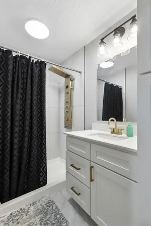 a bathroom with a sink and a mirror