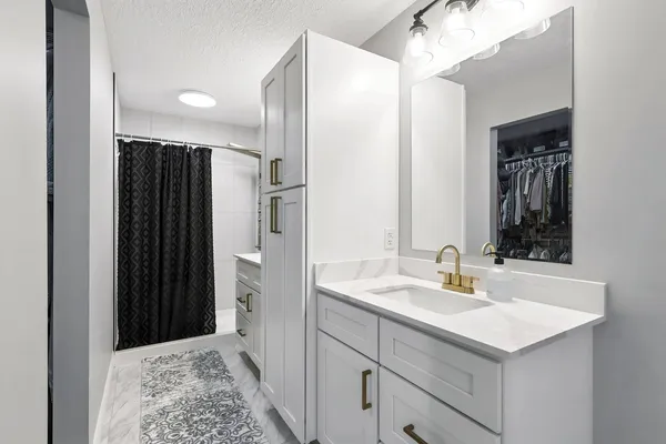 a bathroom with a sink and a mirror