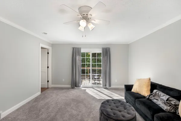 a spacious bedroom with a bed and furniture