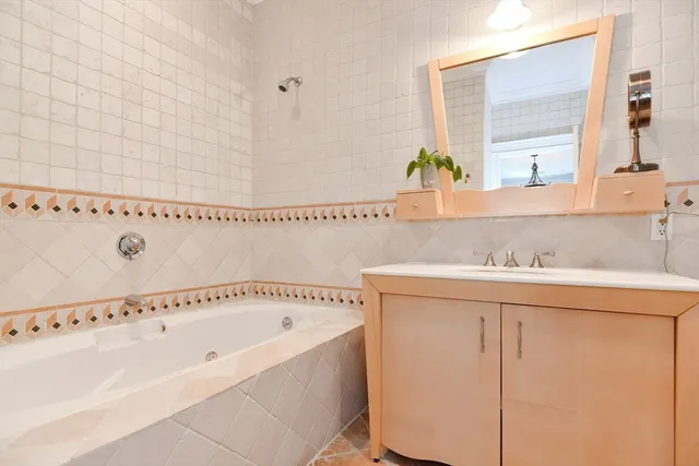 a bathroom with a bathtub and a sink