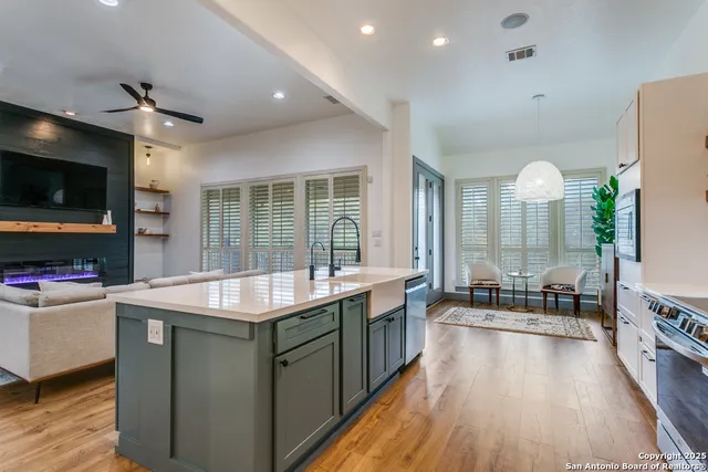 a room with furniture a flat screen tv and a view of living room