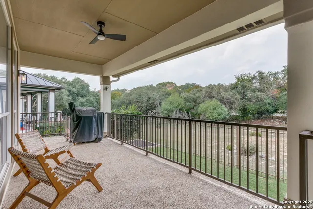a view of a chairs and tables in the balcony