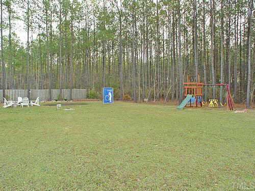 321 Cameron Drive Raleigh, NC 27603 - Photo 10 of 10 backyard is cleared, level and backs up to open space