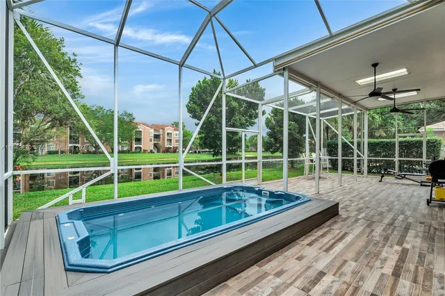 a view of a house with a yard and sitting area