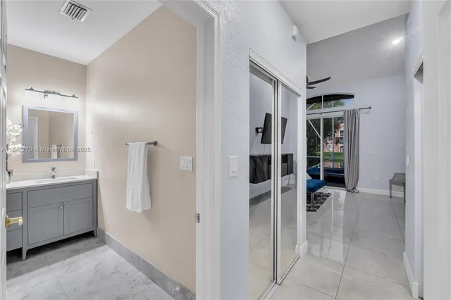 a dining room with furniture and a wooden floor