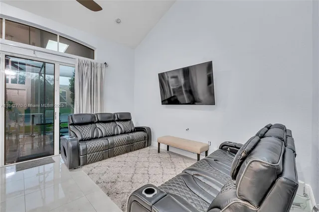 a kitchen with stainless steel appliances granite countertop a sink refrigerator and cabinets