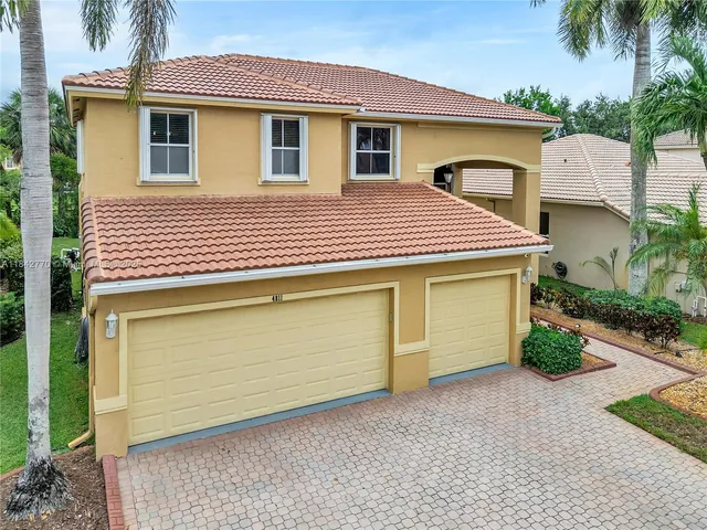 an aerial view of a house with outdoor space