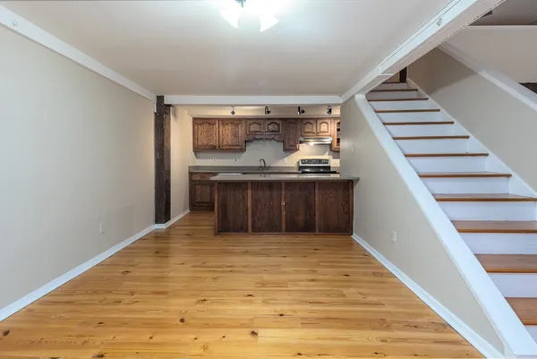 a view of kitchen and kitchen with sink