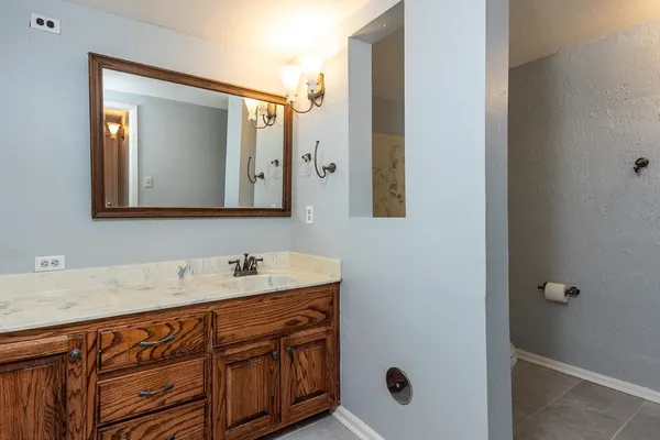 a bathroom with a sink and a mirror
