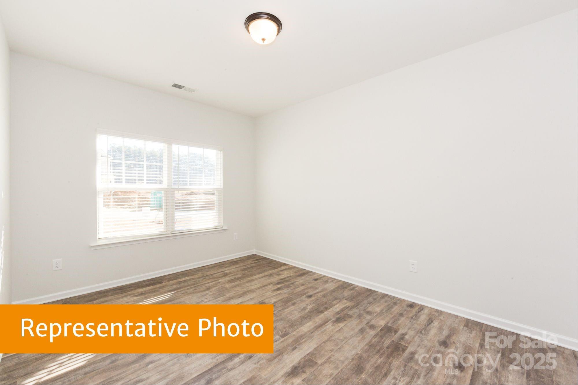 12155 Muscadine Court Midland, NC 28107 - Photo 16 of 20 a view of an empty room and a window