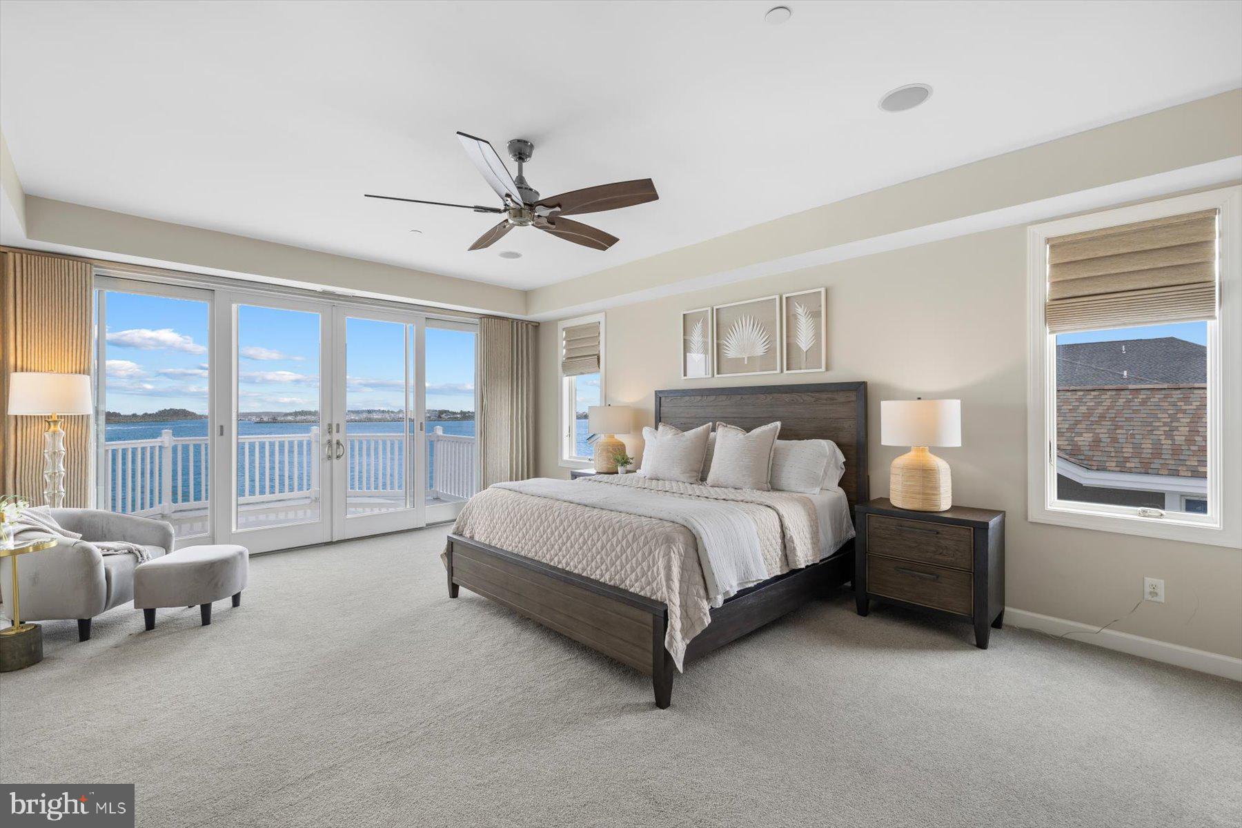 35 Inlet View Court Bethany Beach, DE 19930 - Photo 29 of 74 a spacious bedroom with a bed couch and a large window
