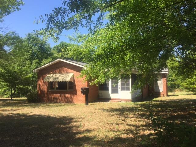 7851 Old Nowell Road, Unit A Macon, GA 31216 - Photo 1 of 10 a front view of a house with a yard