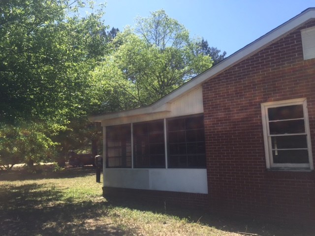 7851 Old Nowell Road, Unit A Macon, GA 31216 - Photo 3 of 10 a view of a house with a yard