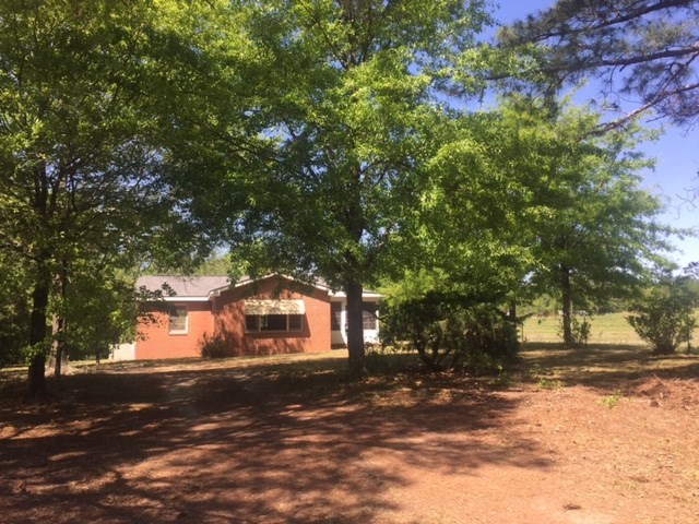 7851 Old Nowell Road, Unit A Macon, GA 31216 - Photo 5 of 10 a front view of a house with a yard