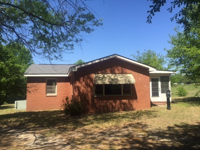 7851 Old Nowell Road, Unit A Macon, GA 31216 - Photo 8 of 10 a front view of a house with a yard
