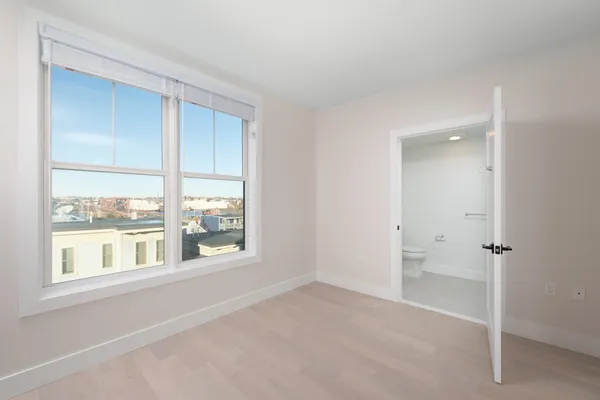 a view of an empty room with a window