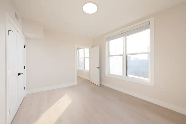 a view of an empty room with a window