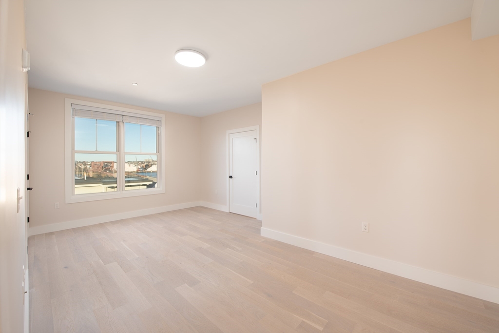 425 Border Street, Unit 307 Boston, MA 02128 - Photo 9 of 19 a view of an empty room with a window