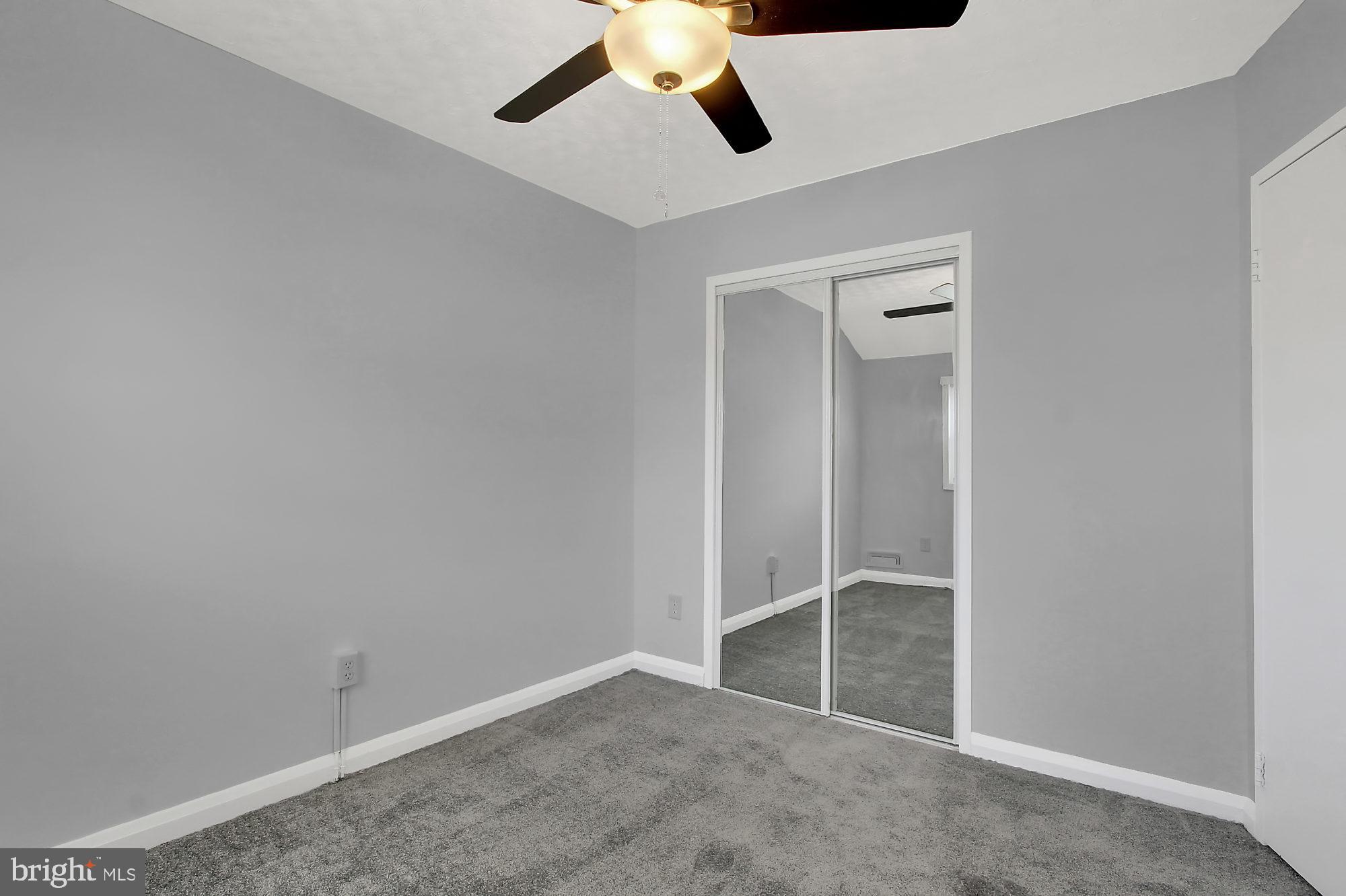 8044 Wallace Road Baltimore, MD 21222 - Photo 13 of 25 BR#2 MIRRORED CLOSET DOORS/CEILING FAN